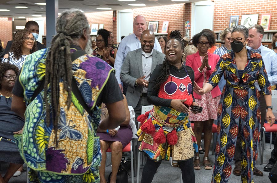 Performers and audience members dancing. Open Gallery